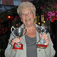 Joan Banks Receives Anuall Trophies